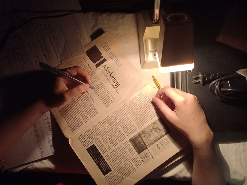 Financial literacy research materials and educational resources on a desk